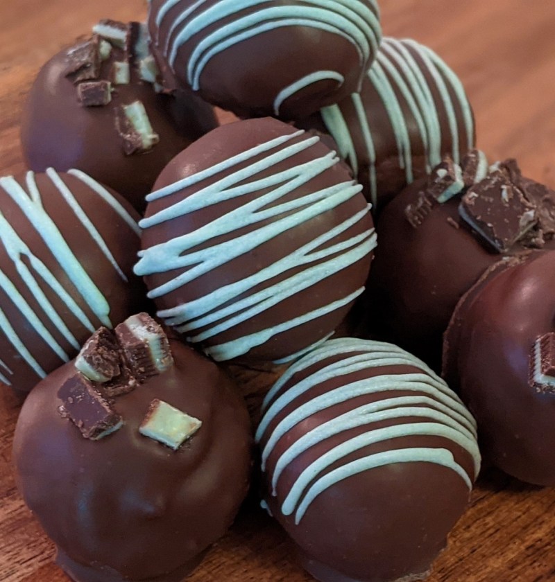 Chocolate balls with blue stripes.