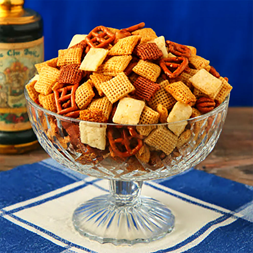 A bowl of snacks with a recipe on the side.