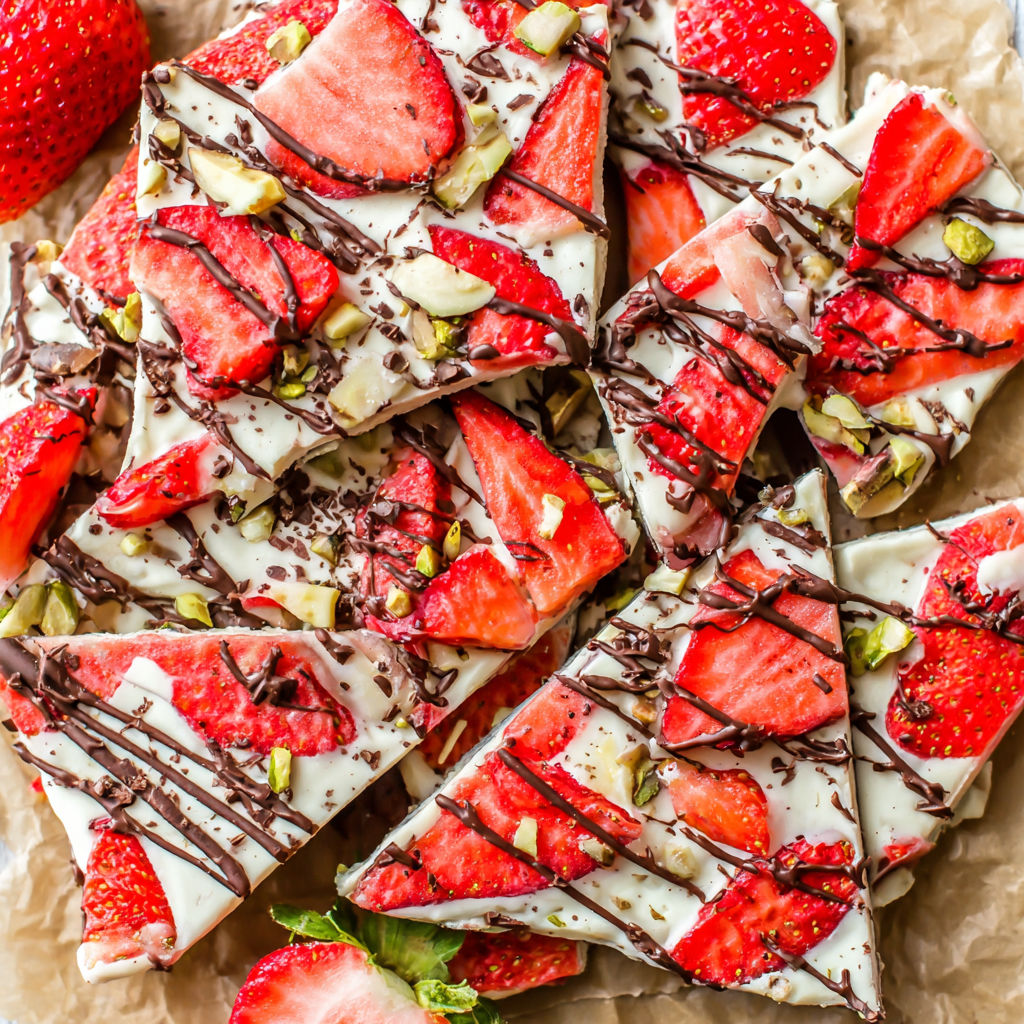 A slice of strawberry cheesecake with chocolate drizzle.