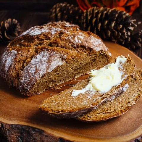 A slice of bread with butter on it.