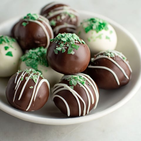 A bowl of chocolate covered marshmallows.
