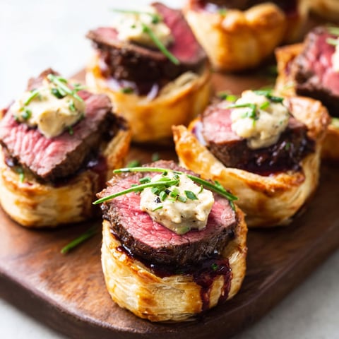 A plate of food with meat and sauce.