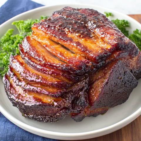A plate of meat with a recipe on the side.