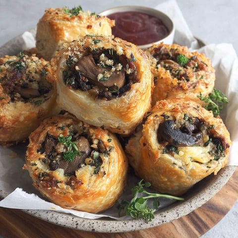 A plate of mushroom and cheese filled pastries.