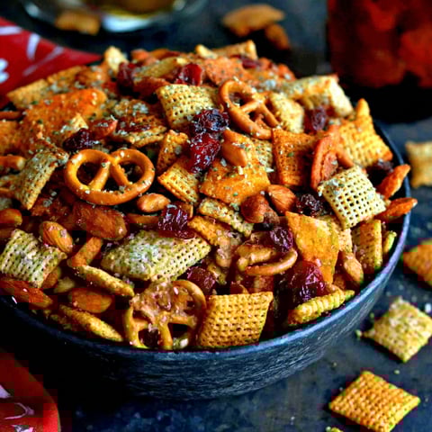 A bowl of chips with a red bowl on top.