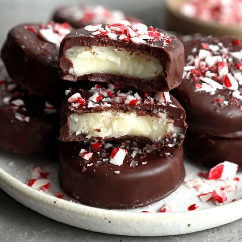 A plate of chocolate cake with red and white sprinkles.
