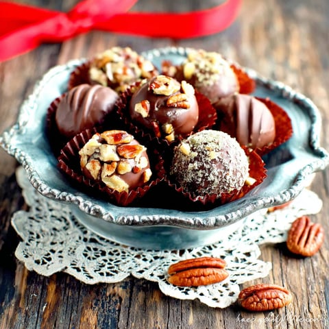 A silver bowl filled with chocolate candies.
