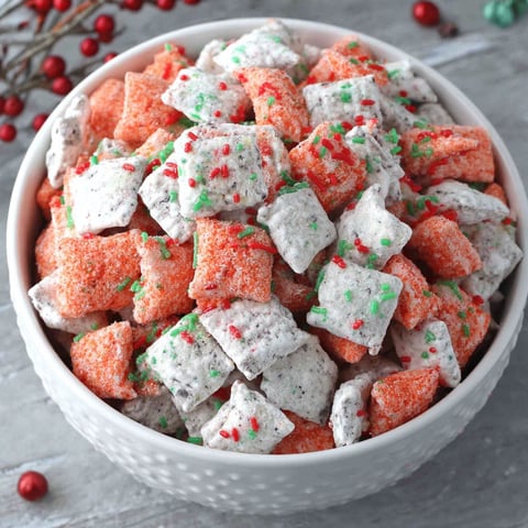 A bowl of candy with red and green colors.