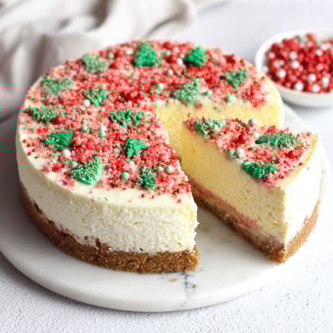 A slice of cake with red and green sprinkles.