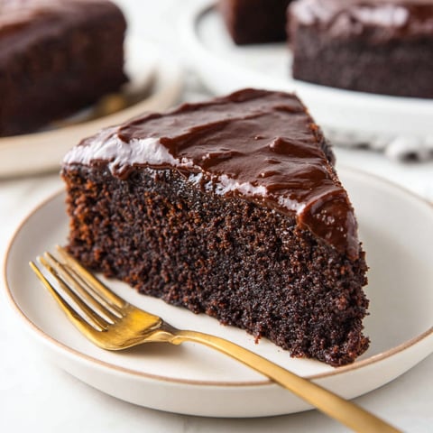 A slice of chocolate cake on a plate.