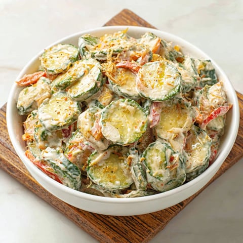 A white bowl filled with a mixture of vegetables.